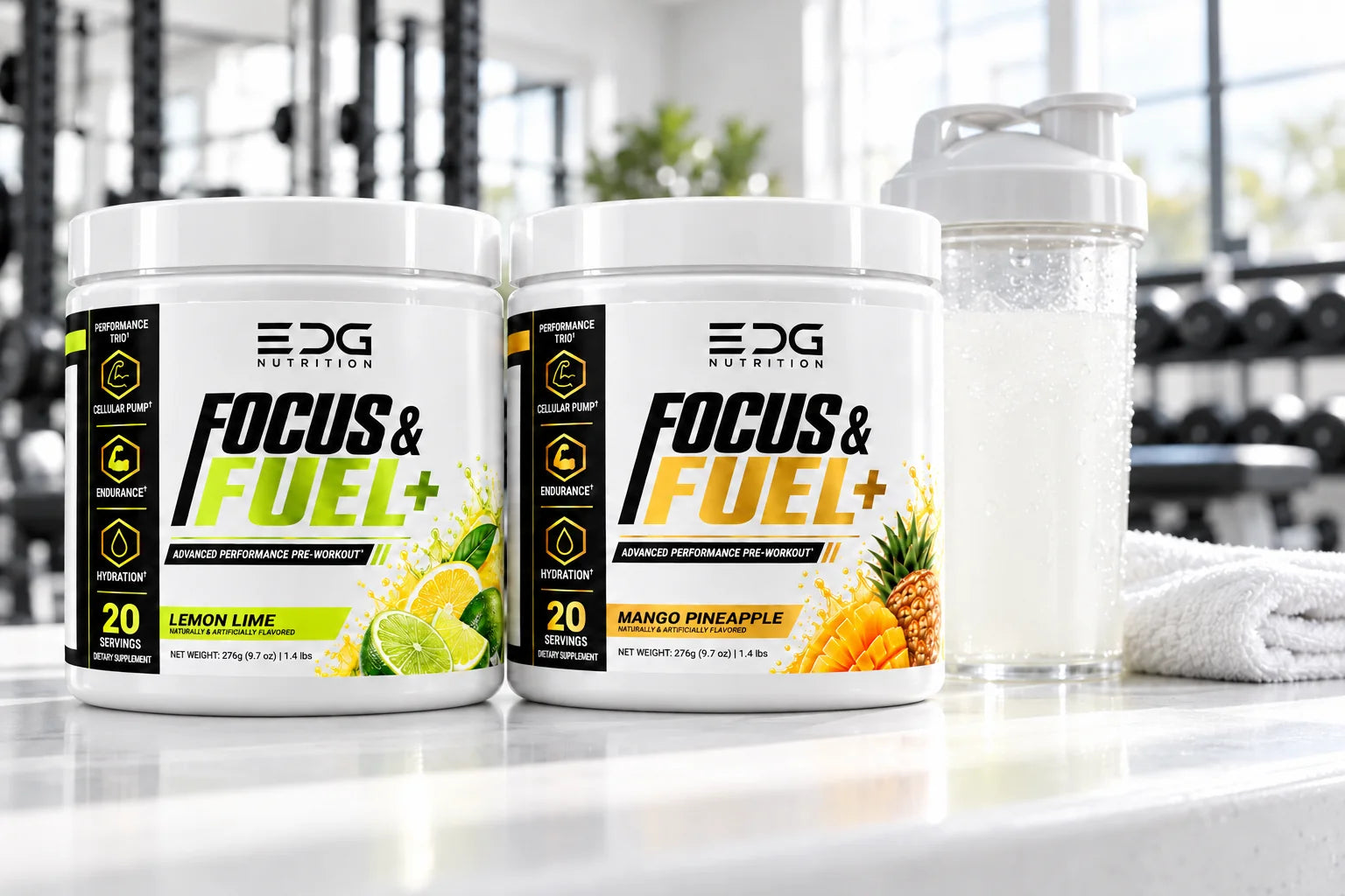 Focus & Fuel+ in Lemon Lime and Mango Pineapple beside a shaker of the mixed drink